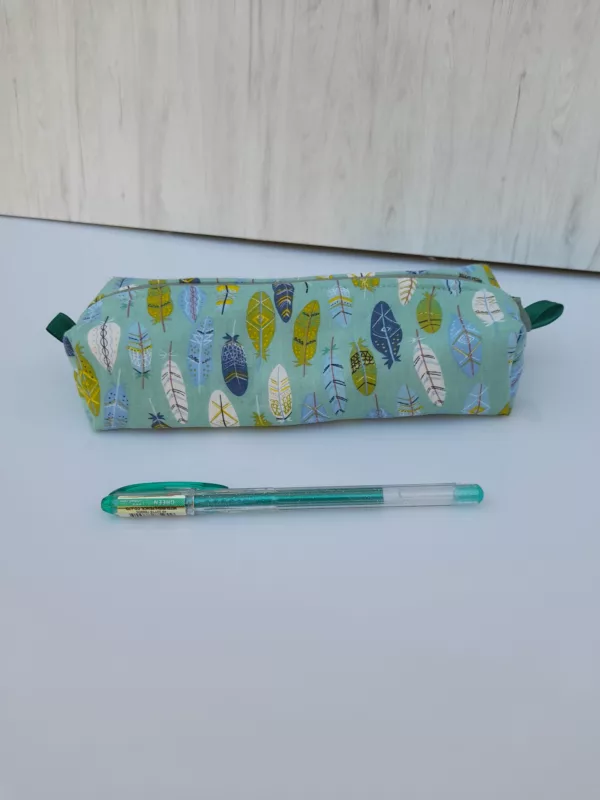 Trousse avec plumes